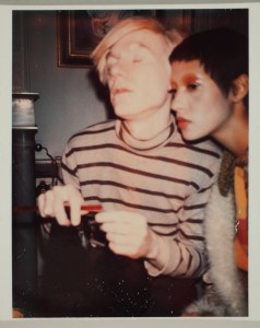 Andy Warhol. Andy Warhol and Unidentified Woman, 1970. Polacolor Type 108. 4 1/2 x 3 3/8 in. Gift of The Andy Warhol Foundation for the Visual Arts, Inc., 2014.002.18. © 2015 The Andy Warhol Foundation for the Visual Arts, Inc. / Artists Rights Society (ARS), New York. Photo: Richard Nicol 